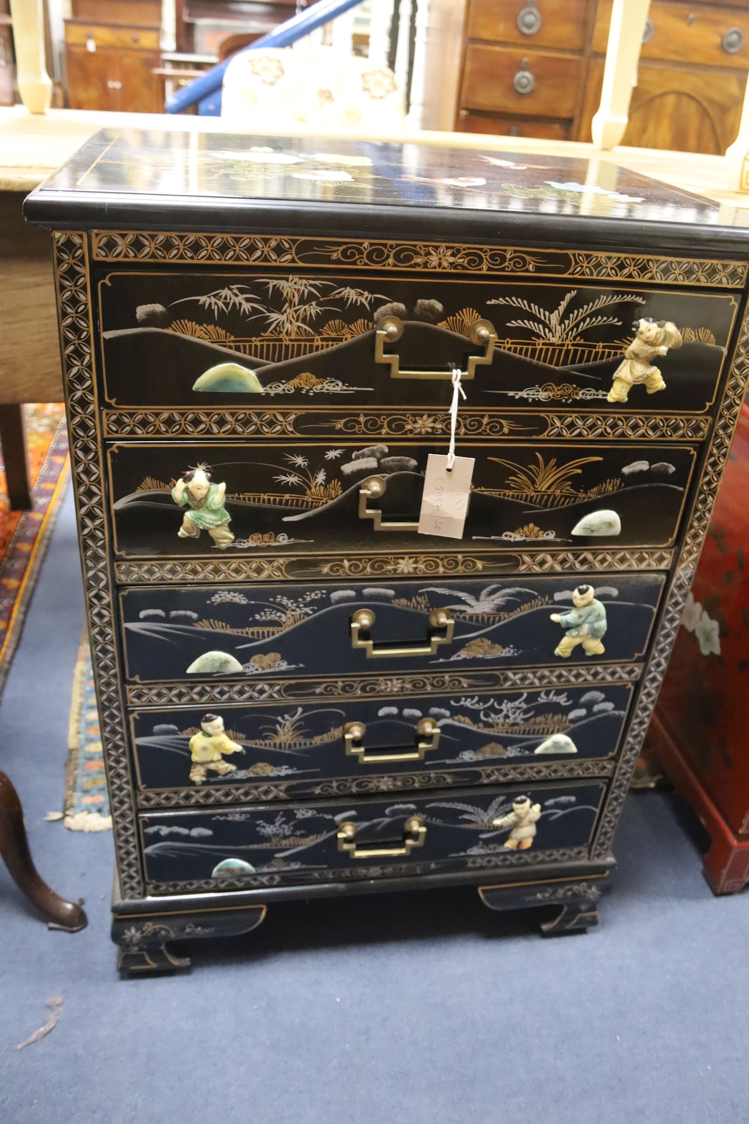 A Chinese black laquer chest of five drawers, a red lacquer chest and a cream lacquer coffee table